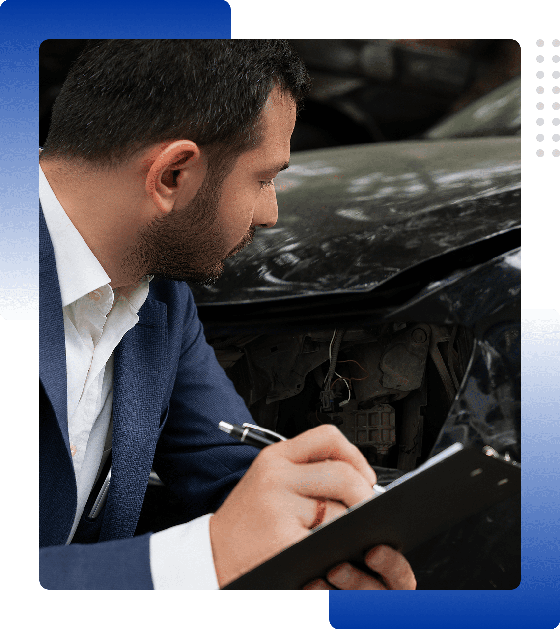 Man inspecting and documenting car engine damage.